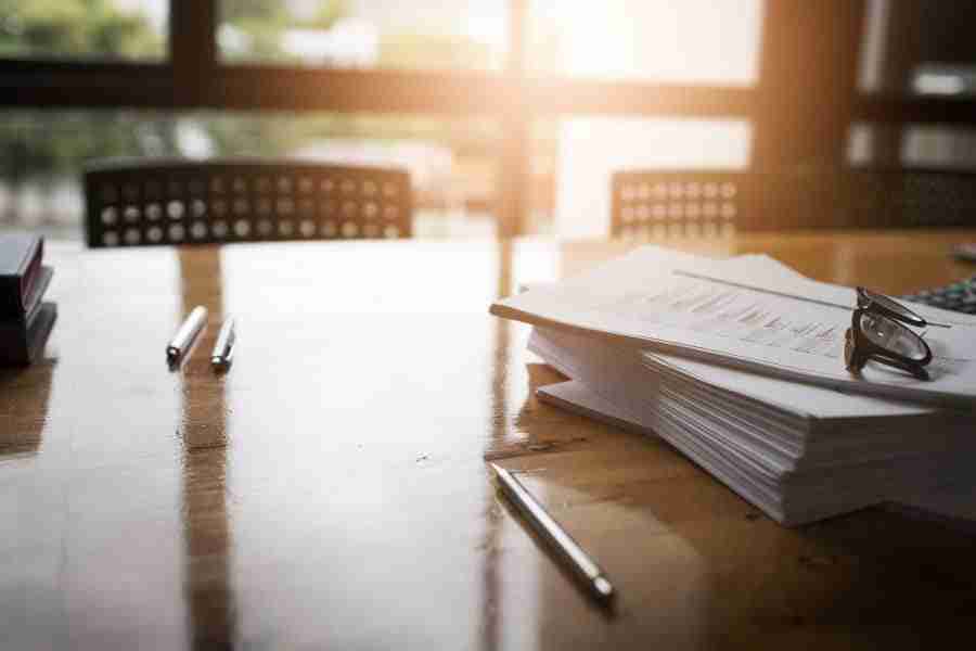 Desk with a stack of papers