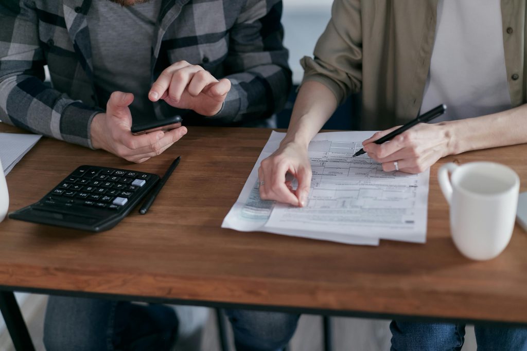 Photo by Mikhail Nilov: https://www.pexels.com/photo/two-people-doing-paperwork-and-computing-taxes-6963053/